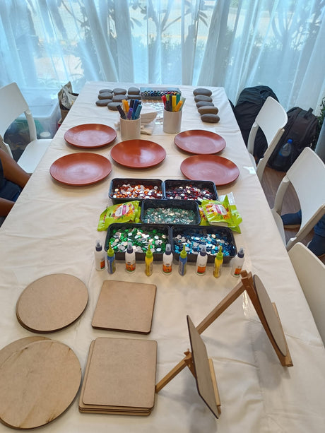 A Kitsters DIY station laid out with material trays before guests arrive