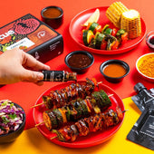 DIY Barbecue Kit tutorial showing how to make skewers with grilled vegetables and meat, using teriyaki sauce, and serving with coleslaw from Kitsters.in