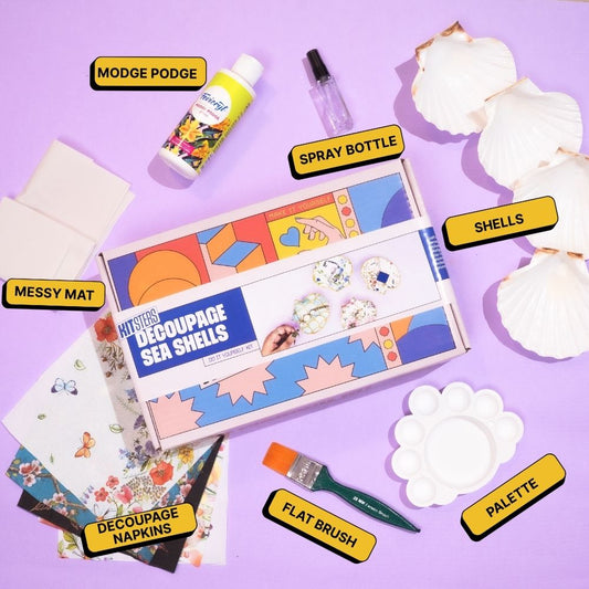 Decoupage sea shells kit with materials on a purple background