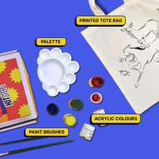 Art supplies including a printed tote bag, palette, acrylic colors, and paint brushes.
