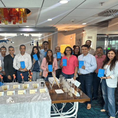 A corporate group holding their kits at a Kitsters-led office session