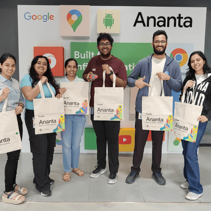 A corporate team holding up what they made at a Kitsters workshop