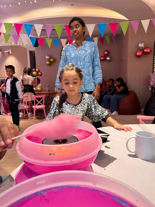 A cotton candy station running at a Kitsters party